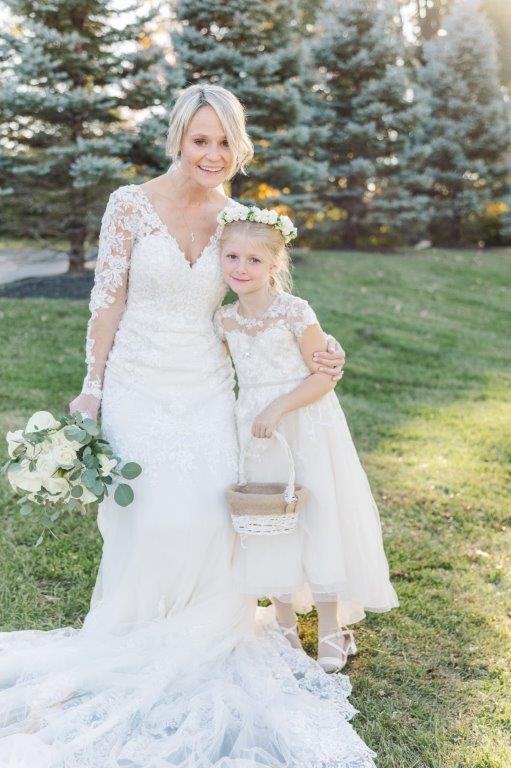 bride and flower girl at wedding manor house