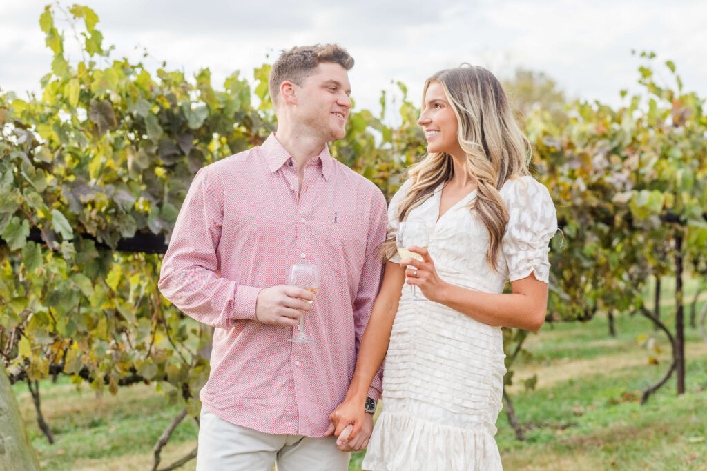 engaged couple getting engagement session photos at brianza gardens and winery