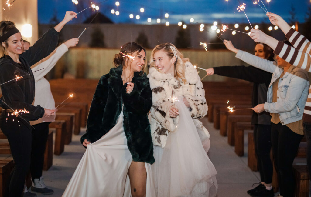 brides in a staged exit with sparklers at mojave east