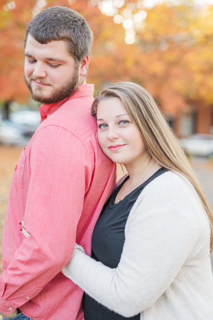 man and woman pose for engagement session from a kentucky wedding photographer