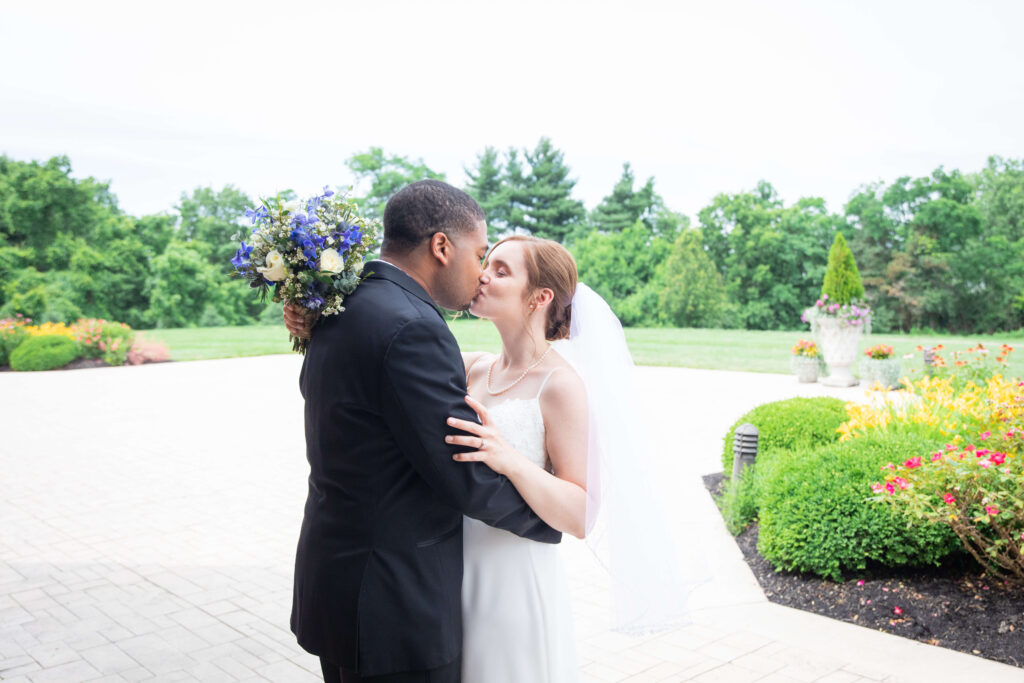 bride and groom kiss at drees pavilion