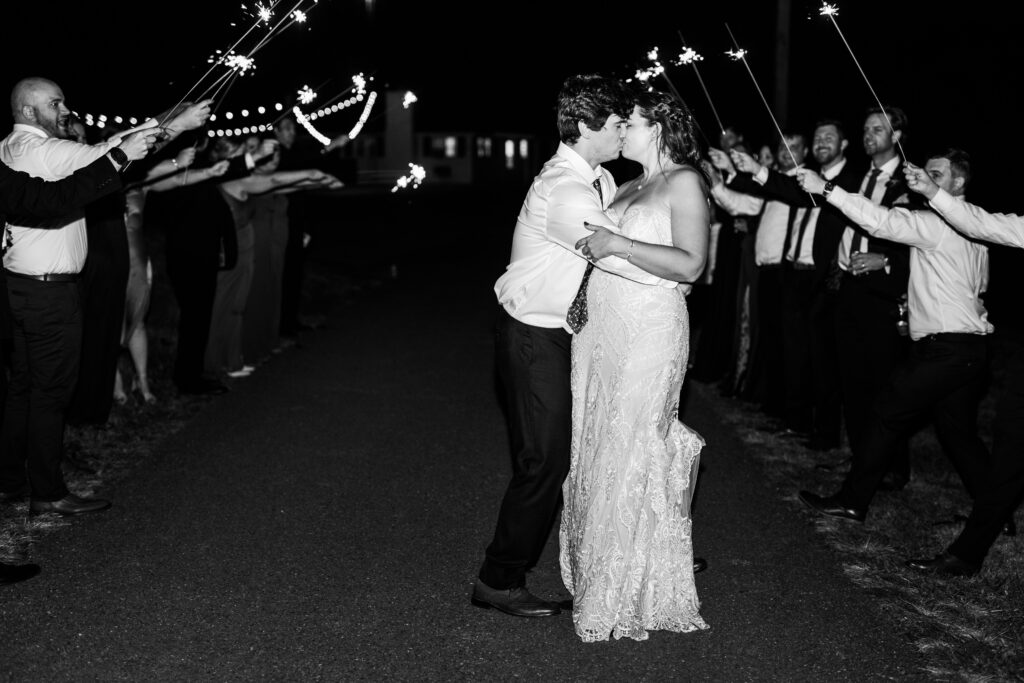 indie hollow sparkler exit with bride and groom kissing