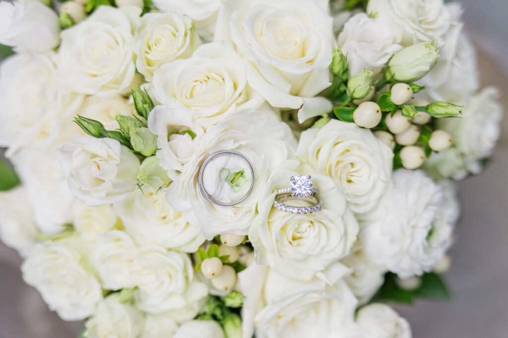 two wedding rings resting on a floral bouquet during a kentucky elopement
