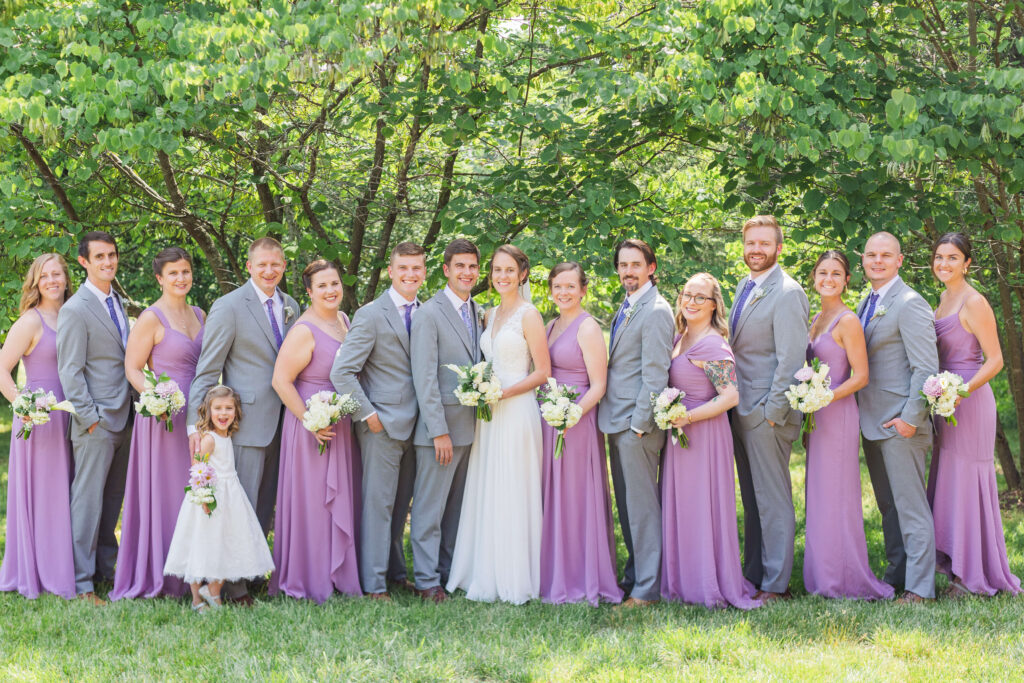 bridal party wearing grey and lavender at sawyer hayes community center