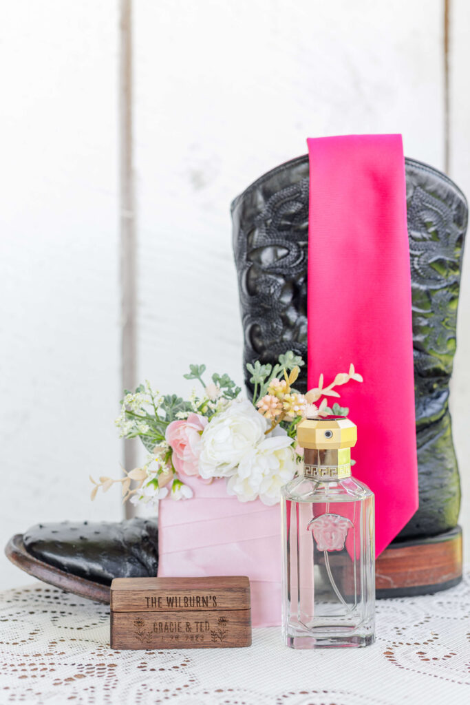 fushia and pink groom details at the white barn venue