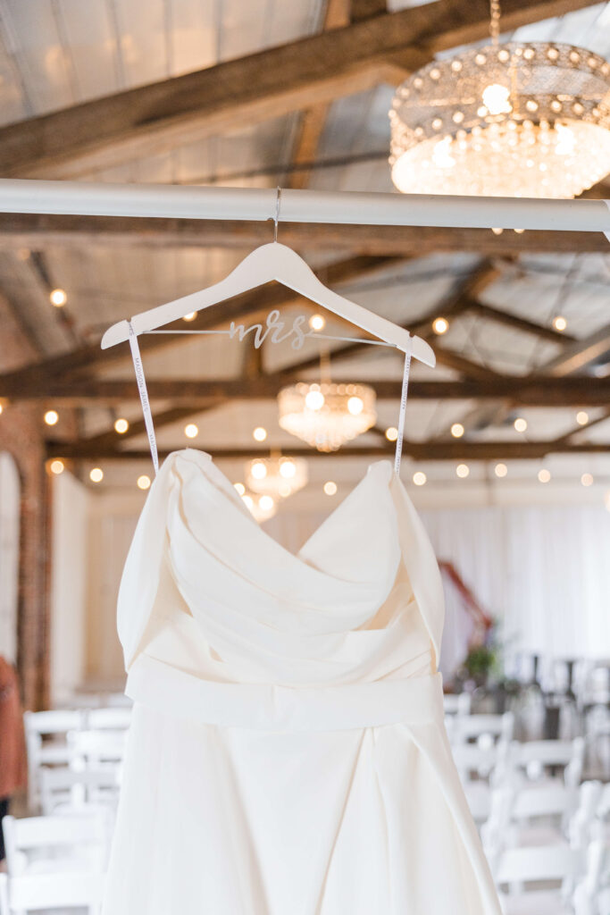 a wedding dress hangs in the brightside dayton