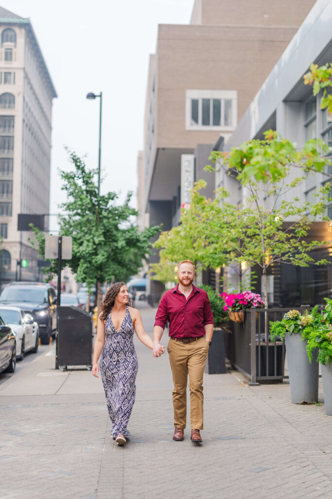 a couple has their downtown cincinnati engagement photos