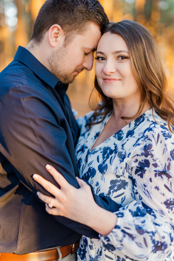 A man and woman have their lexington kentucky engagement photos taken at Jacobson park.
